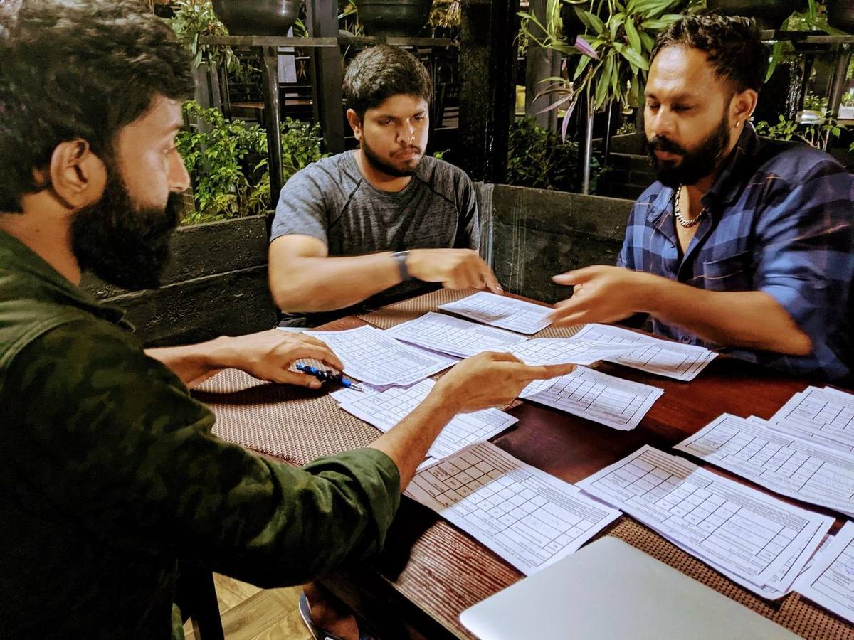 Our team working through rooming lists and registration sheets the night before arrivals